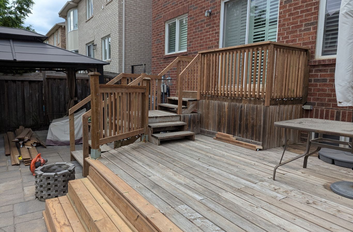Fence Post Repair in Acton - ON as a contractor braces and resets a loose corner post